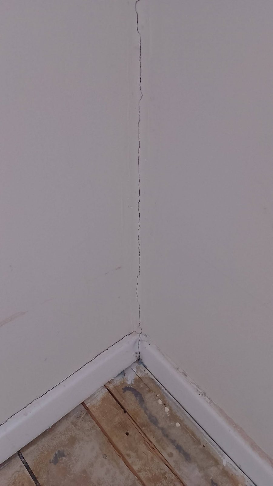 A crack running down an internal corner before filling