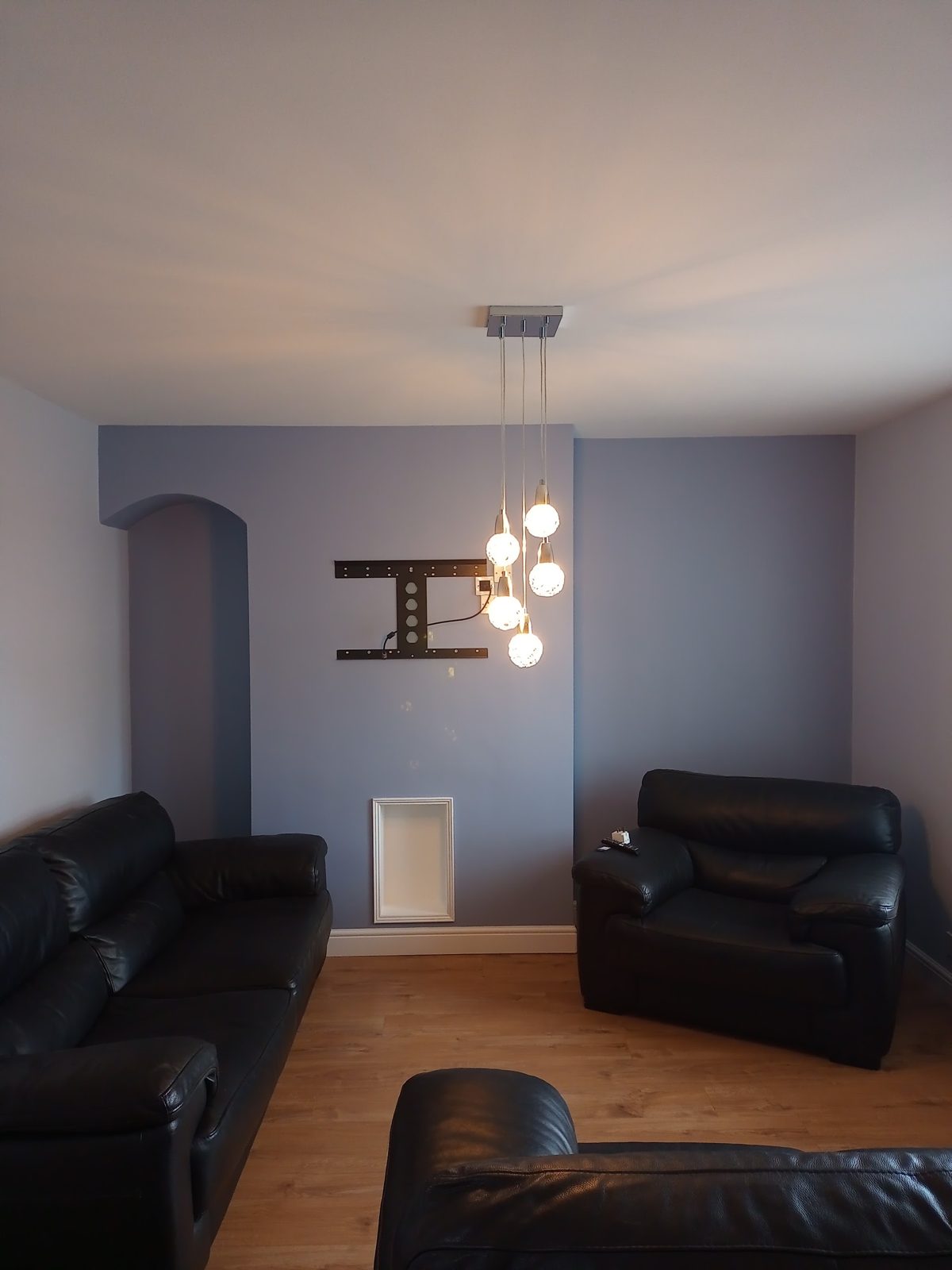 Lounge decorated in a soft blue with white woodwork